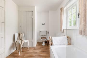 The recently refurbished bathroom looks out over rolling countryside.