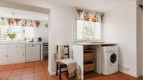 Entering through the side door, this is a great space for dogs and wellies! Behind the gorgeous wooden door is the handy WC.