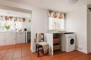 Entering through the side door, this is a great space for dogs and wellies! Behind the gorgeous wooden door is the handy WC.