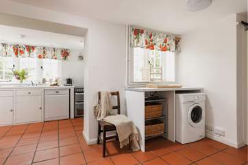 Entering through the side door, this is a great space for dogs and wellies! Behind the gorgeous wooden door is the handy WC.