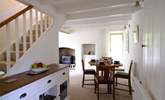 The dining area neatly links the sitting-room and kitchen. - Thumbnail Image