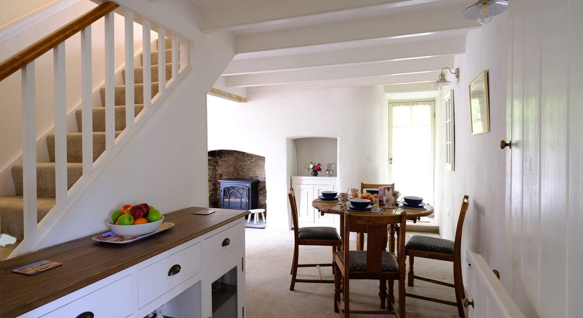 The dining area neatly links the sitting-room and kitchen.