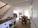 The dining area neatly links the sitting-room and kitchen.
