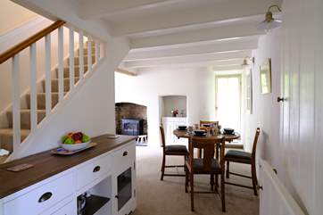 The dining area neatly links the sitting-room and kitchen.