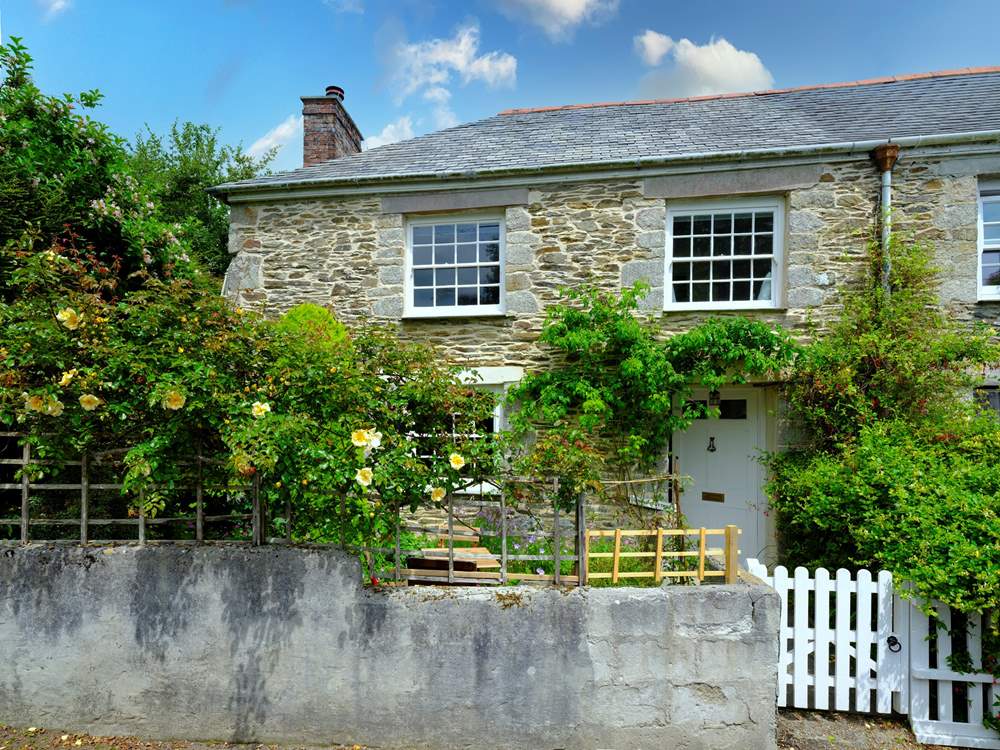 The pretty garden welcomes you to Shell Cottage.