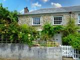 The pretty garden welcomes you to Shell Cottage.