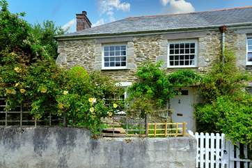 The pretty garden welcomes you to Shell Cottage.