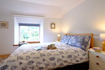 Bedroom one is simple yet stylishly furnished.