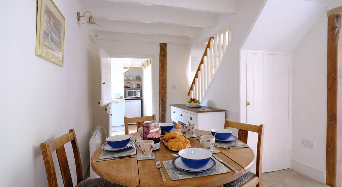 The stairs to the first floor lead off the dining area.