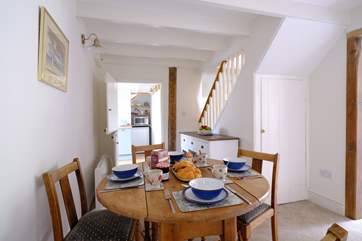 The stairs to the first floor lead off the dining area.