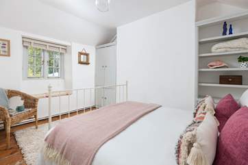 Bedroom Two is beautifully furnished in pastel shades.