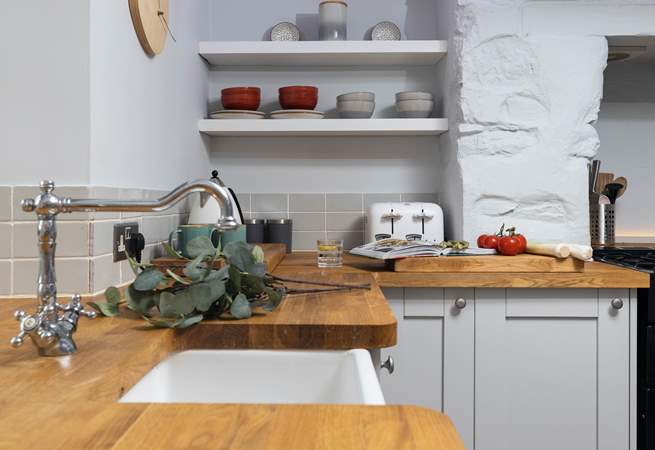 The kitchen is beautifully kitted out with oak worktops and a fabulous range cooker.