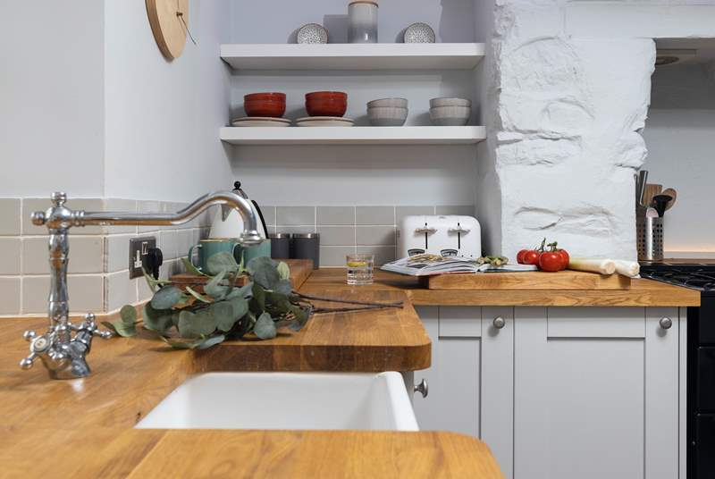 The kitchen is beautifully kitted out with oak worktops and a fabulous range cooker.