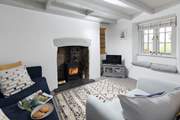 The wood-burner in the comfy sitting-room will keep you toasty during cooler months.