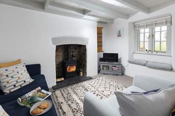 The wood-burner in the comfy sitting-room will keep you toasty during cooler months.
