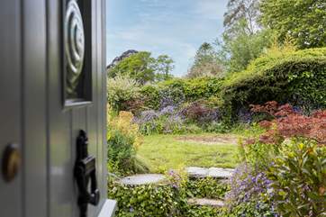 The pretty cottage garden welcomes you.