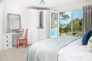 The main bedroom has the most incredible view over the creek and out to sea (bedroom 3).