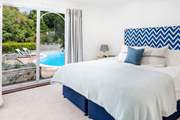 Steps lead straight out to the pool area from your bedroom (3).