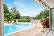 Open the bi-fold doors and look at that view! Perhaps enjoy a moment on the steps taking this lovely place in.