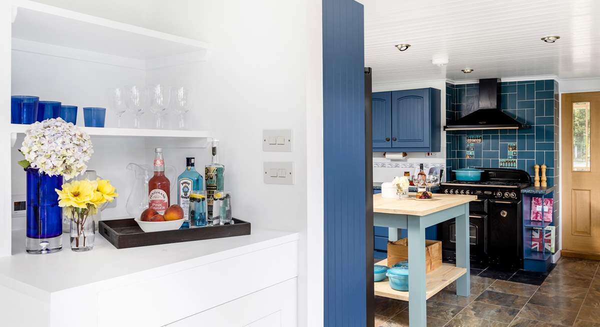 A fabulous drinks station including a wine fridge is set between the dining-room and kitchen. 