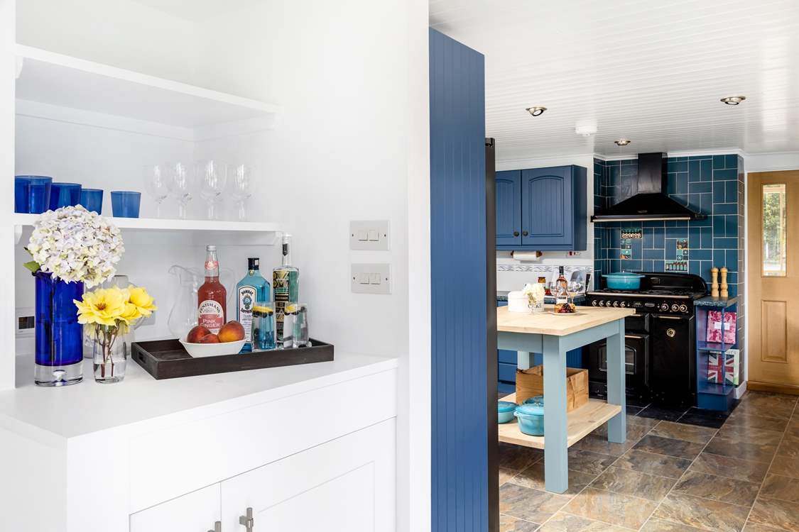 A fabulous drinks station including a wine fridge is set between the dining-room and kitchen.
