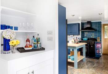 A fabulous drinks station including a wine fridge is set between the dining-room and kitchen. 