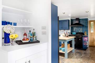 A fabulous drinks station including a wine fridge is set between the dining-room and kitchen.
