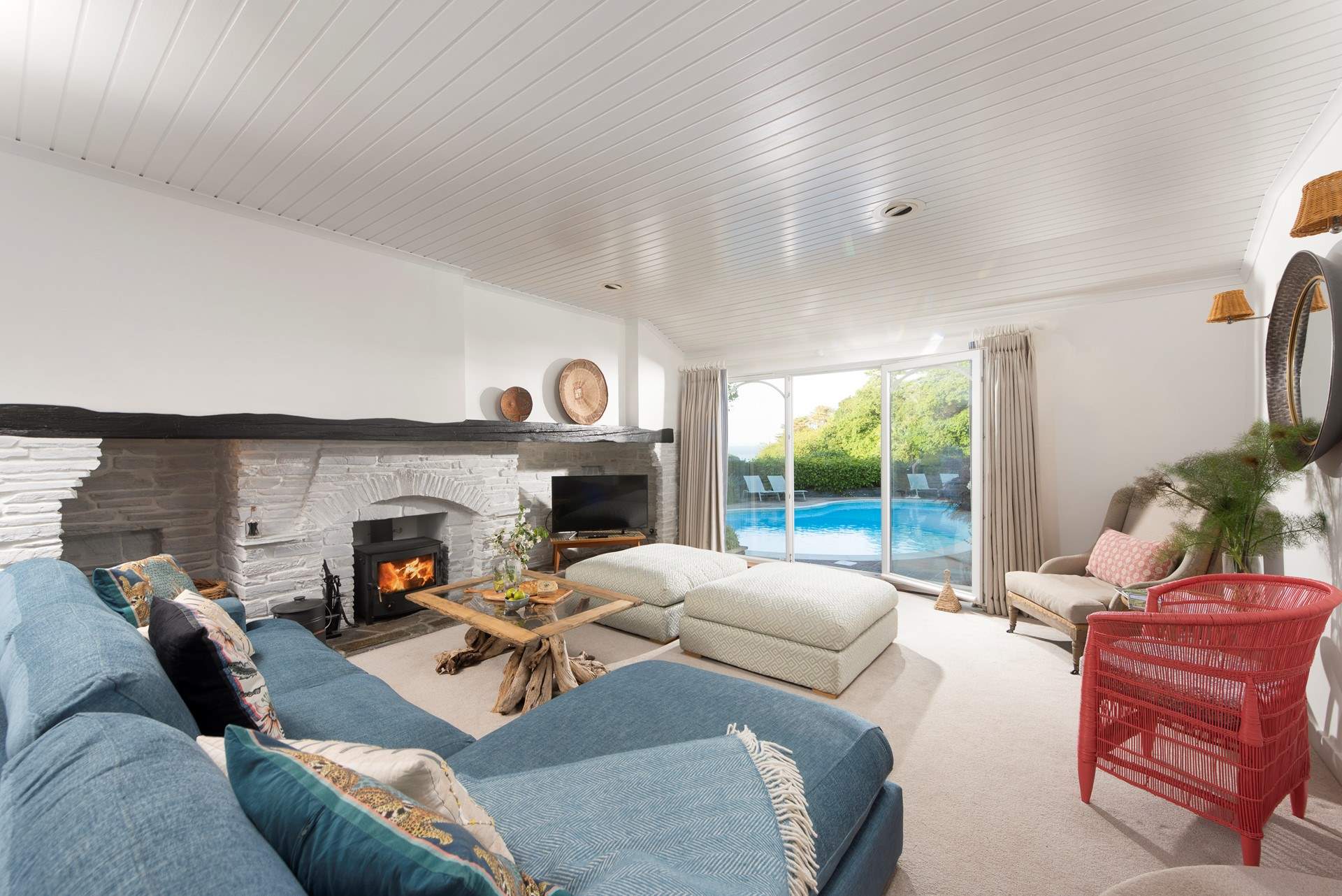 The sitting-room is light and bright with plenty of comfortable seating.