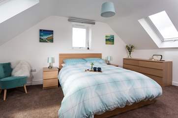 The main bedroom with a king-size bed and en suite shower-room.
