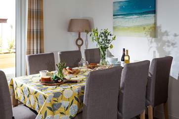 While away the evening chatting together over a bottle of something good at the dining-room table.