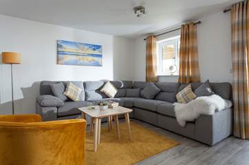 Sit down and relax with a cuppa on this comfy sofa.