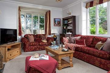 The second sitting-room with a TV and little study area in the corner.
