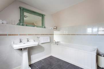 The family bathroom on the second floor, reached via a narrow landing.