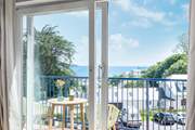 The balcony at Sea Dream is the perfect spot for al fresco dining with a view of Swanpool beach. 