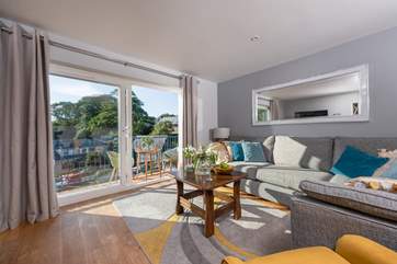 The cosy sitting-room is the perfect place to relax after a busy day out and about.