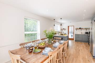 The kitchen/dining-room is wonderfully bright.