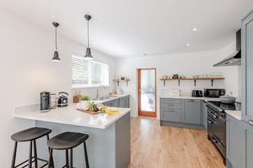The spacious kitchen leads through to the utility-room.