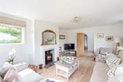 The wood-burner creates a warm and inviting room during those cooler months.