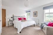 With views to the front of the house Bedroom 2 enjoys views and a en suite Bathroom.