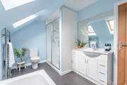 The family bathroom has a bath and separate shower.