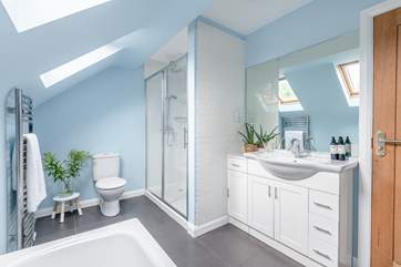 The family bathroom has a bath and separate shower.