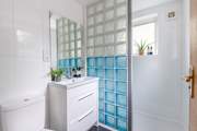 The en suite shower-room with a walk-in shower for bedroom one on the ground floor.