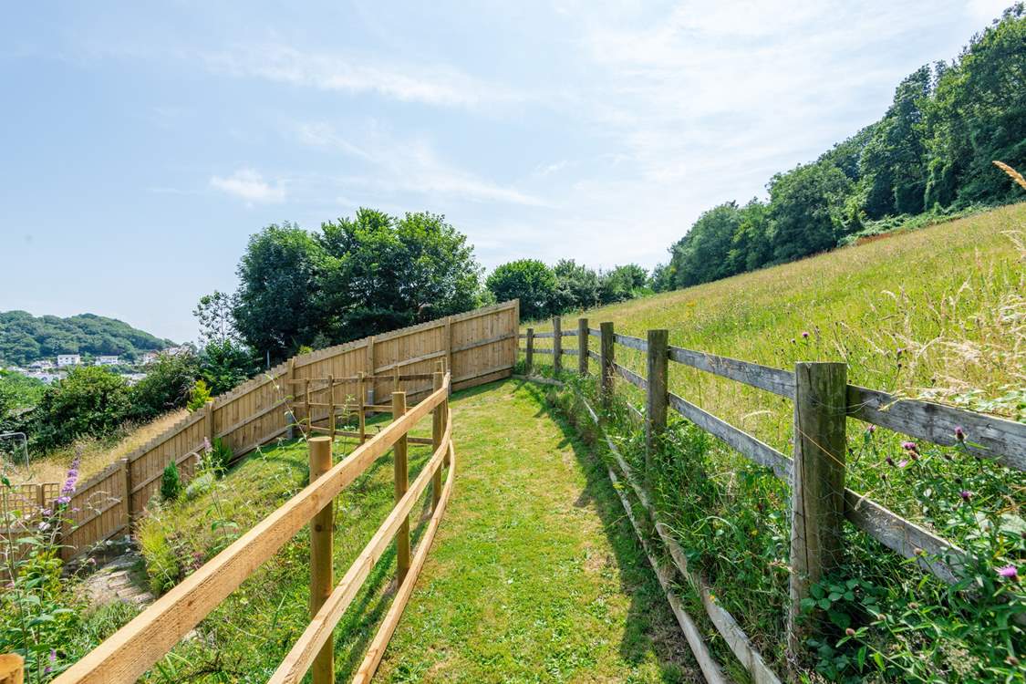 The garden has a unique layout with the path going up the hill.