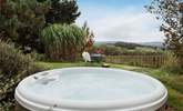 Enjoy your surroundings from the heavenly hot tub. - Thumbnail Image