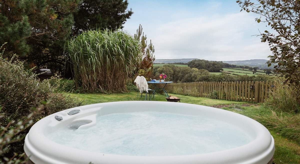 Enjoy your surroundings from the heavenly hot tub.