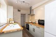 The modern kitchen is light and airy.