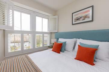 Bedroom 2 has a king-size bed and a lovely outlook.