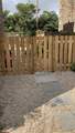 There is a fence and gate on the back patio.