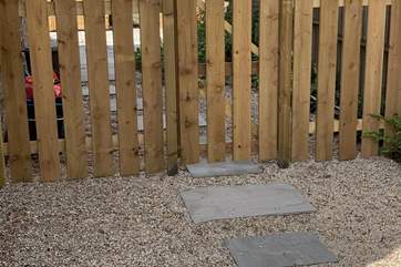 There is a fence and gate on the back patio.