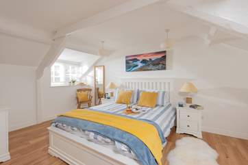 Bedroom 1 has a king-size bed and a lovely nautical feel about it.
